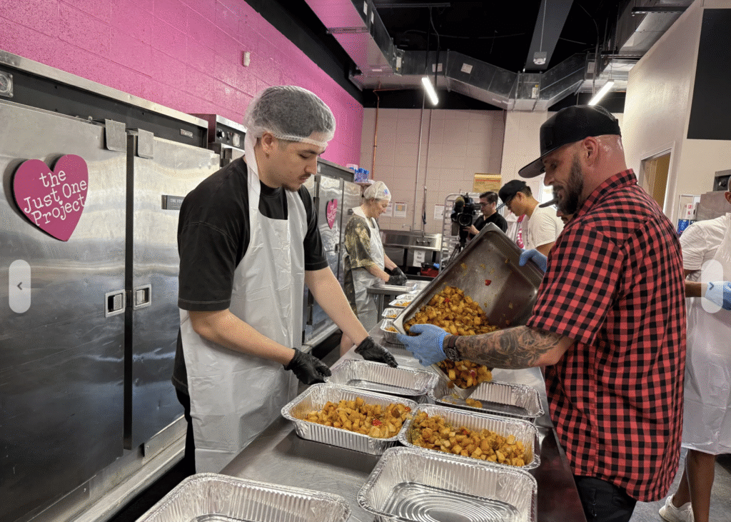 Volunteers in The Just One Project kitchen packaging fresh food from The Venetian Las Vegas.